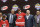 Noah Hanifin, center, poses with team executives after being chosen fifth overall by the Carolina Hurricanes, during the first round of the NHL hockey draft, Friday, June 26, 2015 in Sunrise, Fla. (AP Photo/Alan Diaz)