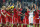 Bayern players celebrate advancing to the quarterfinal after the Champions League round of 16 second leg soccer match between FC Bayern Munich and FC Arsenal in Munich, Germany, Wednesday, March 12, 2014. (AP Photo/Matthias Schrader)