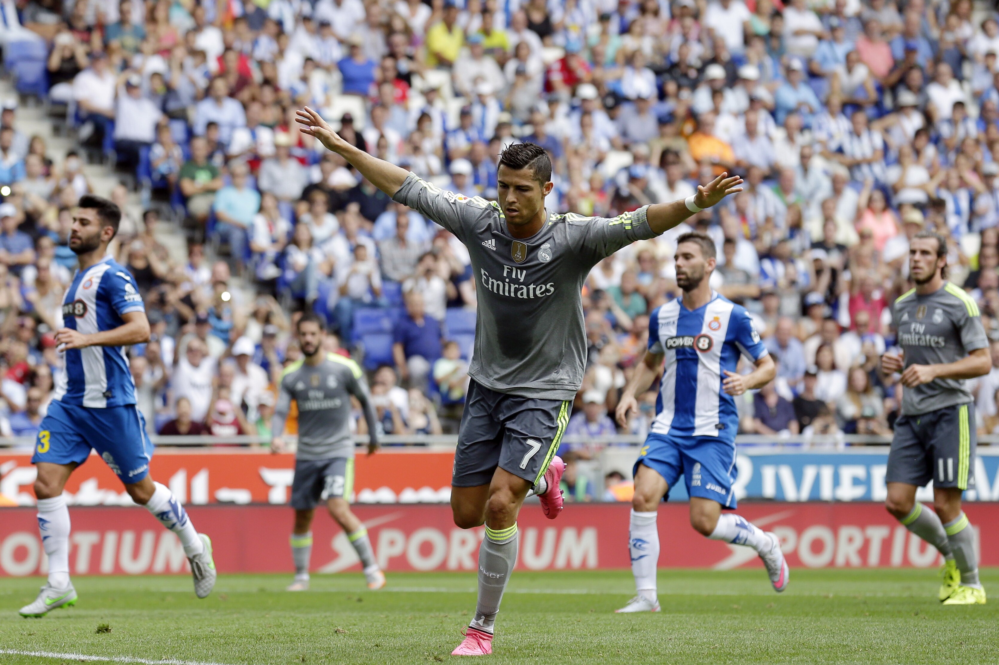 Real Madrid's Cristiano Ronaldo celebrates after scoring against Espanyol during a Spanish La Liga soccer match at Cornella-El Prat stadium in Cornella Llobregat, Spain, Saturday, Sept. 12, 2015. (AP Photo/Manu Fernandez)