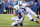 Indianapolis Colts quarterback Andrew Luck (12) slides in front of Buffalo Bills outside linebacker Nigel Bradham (53) during the second half of an NFL football game on Sunday, Sept. 13, 2015, in Orchard Park, N.Y. Buffalo won 27-14. (AP Photo/Gary Wiepert)