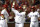 Prince Fielder (centro), de los Rangers de Texas, es felicitado por sus compañeros Mitch Moreland (izquierda) y el dominicano Adrián Beltré, luego de conectar un jonrón de dos carreras frente a los Astros de Houston, el lunes 14 de septiembre de 2015 (AP Foto/Jeffrey McWhorter)