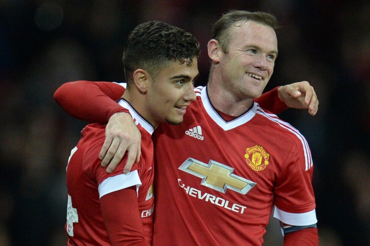 Manchester United's Belgian midfielder Andreas Pereira (L) celebrates with Manchester United's English striker Wayne Rooney after scoring their second goal from a free-kick during the English League Cup third round football match between Manchester United and Ipswich Town at Old Trafford in Manchester, north west England on September 23, 2015. AFP PHOTO / OLI SCARFF
RESTRICTED TO EDITORIAL USE. No use with unauthorized audio, video, data, fixture lists, club/league logos or 'live' services. Online in-match use limited to 75 images, no video emulation. No use in betting, games or single club/league/player publications. (Photo credit should read OLI SCARFF/AFP/Getty Images)