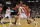 Memphis Grizzlies guard Beno Udrih drives past Houston Rockets center Dwight Howard in the second half of an NBA basketball game Monday, Nov. 17, 2014, in Memphis, Tenn. The Grizzlies won 119-93. (AP Photo/Brandon Dill)