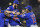 Chicago Cubs first baseman Anthony Rizzo, (44), holds Chicago Cubs starting pitcher Jake Arrieta as shortstop Starlin Castro (13) joins in the celebration after they defeated the Pittsburgh Pirates in the National League wild card baseball game 4-0, Wednesday, Oct. 7, 2015, in Pittsburgh. The Cubs advance to play the St. Louis Cardinals in the National League Division Series. (AP Photo/Don Wright)