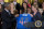 President Barack Obama receives a jersey from head coach Jill Ellis as he welcomes the U.S. Women's National Soccer Team, Tuesday, Oct. 27, 2015, in the East Room of the White House in Washington, during a ceremony to honor the team and their victory in the 2015 FIFA Women's World Cup. In the background right of Obama are Julie Johnston, Sydney Leroux, and Carli Lloyd.  (AP Photo/Carolyn Kaster)