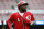 Cincinnati Reds' Brandon Phillips runs back to the dugout after being tagged out by Chicago Cubs second baseman Addison Russell when he slipped a lead toward home in the sixth inning of a baseball game, Thursday, Oct. 1, 2015, in Cincinnati. The Cubs won 5-3. (AP Photo/John Minchillo)
