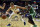 Sixteen-year-old Slovenian wunderkind Luka Doncic reaches for a loose ball during a Real Madrid exhibition game against the Boston Celtics in October. Doncic is already earning playing time for Madrid and NBA draft buzz is emerging around the young prospect.
