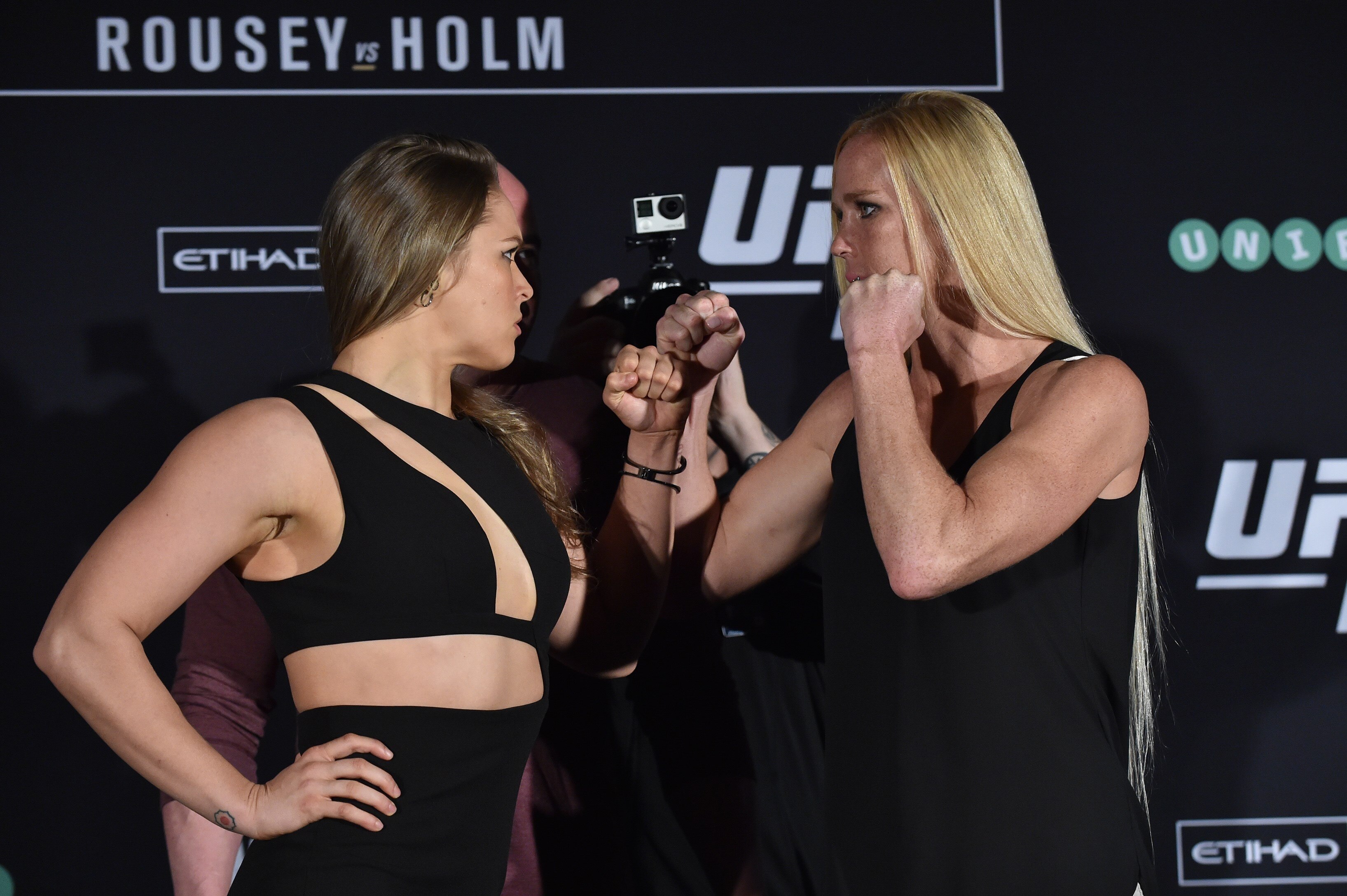 Ronda Rousey of the US (L) faces-off with compatriot Holly Holm (R) for the UFC fight in Melbourne on November 13, 2015. Over 55,000 are expected to attend the UFC fight between Rousey and compatriot Holly Holm in Melbourne on November 15. RESTRICTED TO EDITORIAL USE NO ADVERTISING USE NO PROMOTIONAL USE NO MERCHANDISING USE AFP PHOTO/Paul CROCK (Photo credit should read PAUL CROCK/AFP/Getty Images)