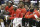 Houston Rockets, from left, Montrezl Harrell, Ty Lawson, Dwight Howard and James Harden, right, watch the final minutes of an NBA basketball game against the Boston Celtics from the bench, Monday, Nov. 16, 2015, in Houston. Boston won 111-95. (AP Photo/Pat Sullivan)