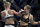 Holly Holm, left, and Ronda Rousey exchange their punches during their UFC 193 bantamweight title fight in Melbourne, Australia, Sunday, Nov. 15, 2015. Holm pulled off a stunning upset victory over Rousey in the fight, knocking out the women's bantamweight champion in the second round with a powerful kick to the head Sunday. (AP Photo/Andy Brownbill)