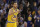 Golden State Warriors guard Stephen Curry (30) reacts after making a 3-point basket during the first half of an NBA basketball game against the Los Angeles Lakers in Oakland, Calif., Tuesday, Nov. 24, 2015. (AP Photo/Jeff Chiu)