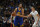 Golden State Warriors center Andrew Bogut (12) looks to pass the ball as Denver Nuggets center Nikola Jokic (15) defends in the second half of an NBA basketball game Sunday, Nov. 22, 2015, in Denver. Golden State won 118-105. (AP Photo/David Zalubowski)