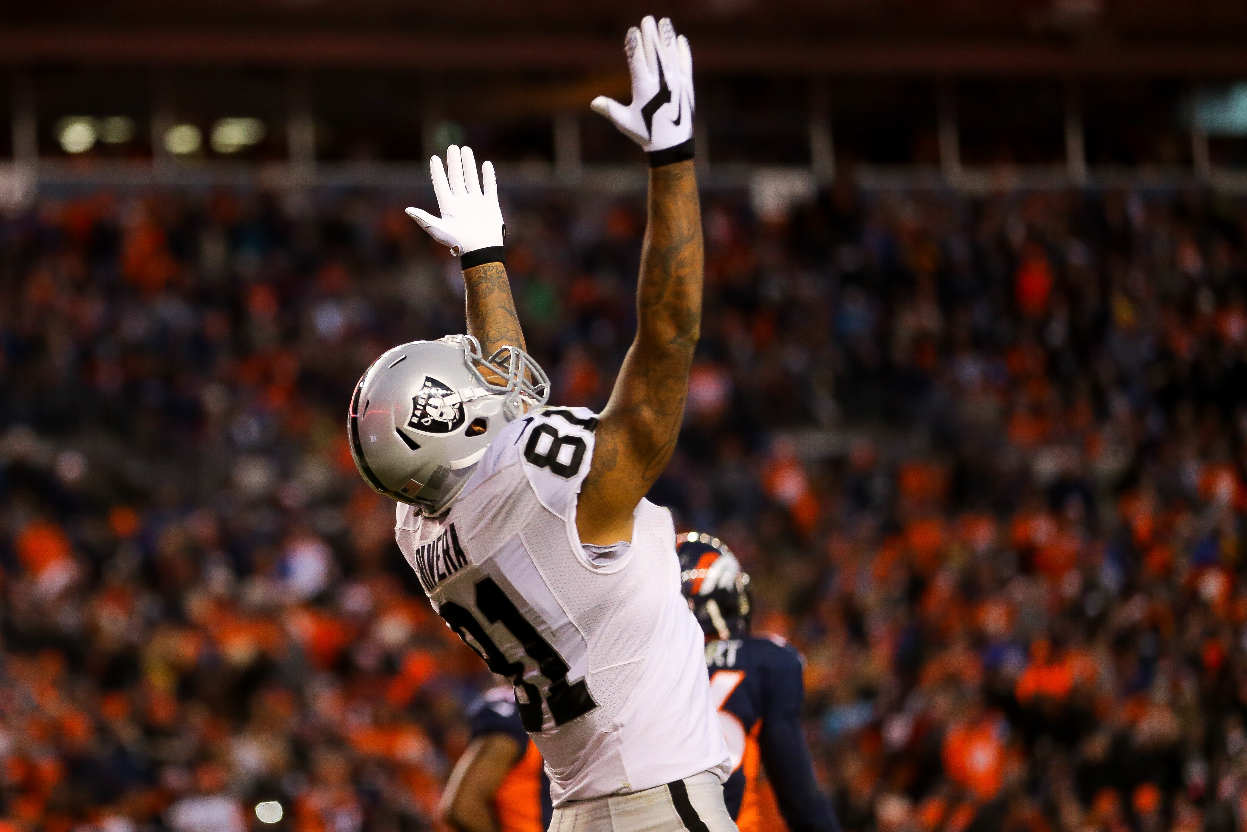 DENVER, CO - DECEMBER 13: Tight end Mychal Rivera #81 of the Oakland Raiders celebrates after a 16 yard fourth quarter touchdown reception for at Sports Authority Field at Mile High on December 13, 2015 in Denver, Colorado. (Photo by Justin Edmonds/Getty Images)