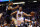 Golden State Warriors guard Stephen Curry (30) drives around Phoenix Suns center Tyson Chandler in the second quarter during an NBA basketball game, Friday, Nov. 27, 2015, in Phoenix. (AP Photo/Rick Scuteri)