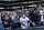 Fans reach for memorabilia tossed to them after a Seattle Mariners baseball game Sunday, Oct. 4, 2015, in Seattle. The Mariners won 3-2. (AP Photo/Elaine Thompson)