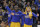 Golden State Warriors guard Stephen Curry, right, celebrates on the bench with forward Draymond Green, center, and forward Harrison Barnes during the second half of an NBA basketball game against the Los Angeles Lakers in Oakland, Calif., Tuesday, Nov. 24, 2015. The Warriors won 111-77. (AP Photo/Jeff Chiu)