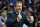 Kentucky head coach John Calipari calls out to his team during the first half of an NCAA college basketball game against Ohio State Saturday, Dec. 19, 2015, in New York. (AP Photo/Frank Franklin II)