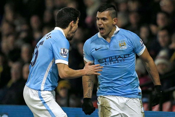 Manchester City's Argentinian striker Sergio Aguero celebrates with Manchester City's Spanish midfielder Jesus Navas (L) after scoring their second goal during the English Premier League football match between Watford and Manchester City at Vicarage Road Stadium in Watford, north of London on January 2, 2016. AFP PHOTO / ADRIAN DENNISRESTRICTED TO EDITORIAL USE. NO USE WITH UNAUTHORIZED AUDIO, VIDEO, DATA, FIXTURE LISTS, CLUB/LEAGUE LOGOS OR 'LIVE' SERVICES. ONLINE IN-MATCH USE LIMITED TO 75 IMAGES, NO VIDEO EMULATION. NO USE IN BETTING, GAMES OR SINGLE CLUB/LEAGUE/PLAYER PUBLICATIONS. / AFP / ADRIAN DENNIS (Photo credit should read ADRIAN DENNIS/AFP/Getty Images)