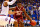 LAWRENCE, KS - JANUARY 04:  Buddy Hield #24 of the Oklahoma Sooners controls the ball as Frank Mason III #0 and Landen Lucas #33 of the Kansas Jayhawks defend during the game at Allen Fieldhouse on January 4, 2016 in Lawrence, Kansas.  (Photo by Jamie Squire/Getty Images)
