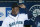 Seattle Mariners' Ken Griffey Jr. smiles while adjusting his cap in the dugout before the baseball game against the Texas Rangers in Seattle on Sunday, Oct. 4, 2009. (AP Photo/John Froschauer)