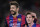 Barcelona's Gerard Pique, left and Lionel Messi leave the field at the end of a Spanish La Liga soccer match between FC Barcelona and Real Madrid at Camp Nou stadium, in Barcelona, Spain, Sunday, March 22, 2015. (AP Photo/Manu Fernandez)