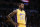 Los Angeles Lakers' Tarik Black looks on during the first half of an NBA preseason basketball game against the Portland Trail Blazers, Monday, Oct. 19, 2015, in Los Angeles. (AP Photo/Jae C. Hong)