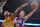 Sacramento Kings guard Nik Stauskas, right, shoots as Los Angeles Lakers center Robert Sacre defends during the second half of an NBA basketball game, Wednesday, April 15, 2015, in Los Angeles. The Kings won 122-99. (AP Photo/Mark J. Terrill)