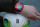 FILE - The Dec. 8, 2012 file photo shows a referee's watch with the goal as they demonstrate the goal-line technology of Hawk-Eye system at Toyota stadium in Toyota. The Bundesliga clubs have approved goal-line technology that will be introduced at the start of the next season. The technology chosen is the Hawk-Eye system, which is also used by England's Premier League.  (AP Photo/Shuji Kajiyama)