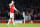 Arsenal's Mesut Ozil puts his hand to his head as he waits for a free kick to be taken during the English Premier League soccer match between Arsenal and Chelsea at the Emirates stadium in London, Sunday, Jan. 24, 2016.(AP Photo/Frank Augstein)