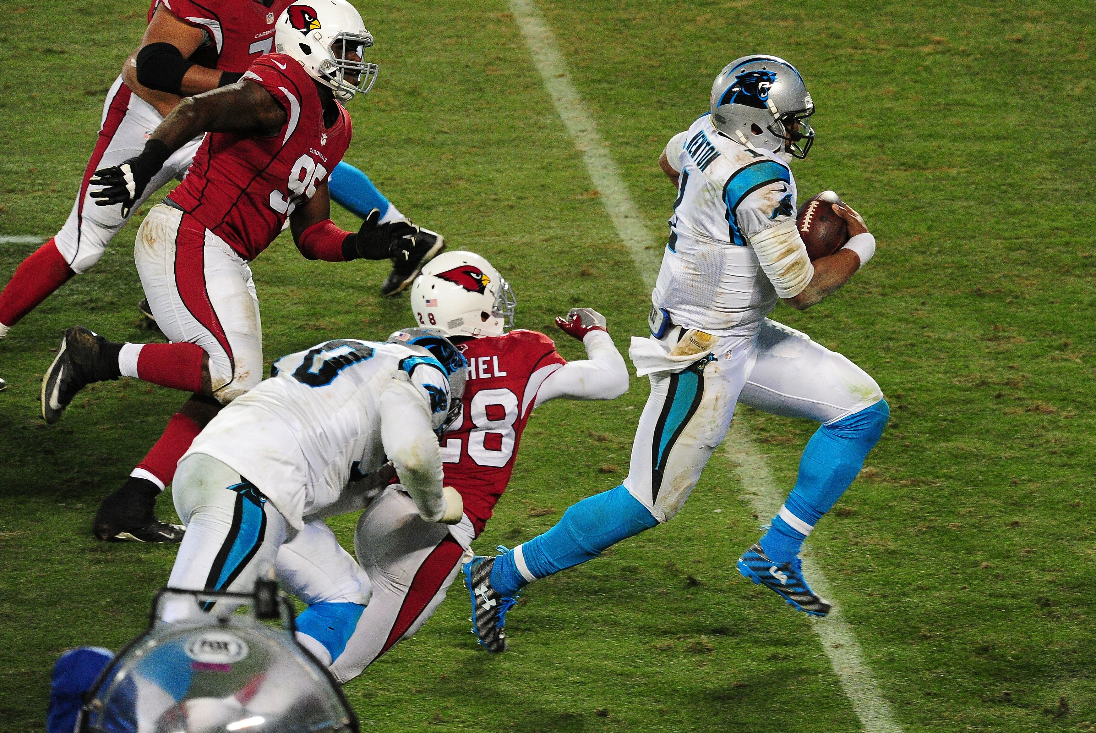 CHARLOTTE, NC - JANUARY 24: Cam Newton #1 of the Carolina Panthers carries the ball for a touchdown against the Arizona Cardinals during the NFC Championship Game at Bank Of America Stadium on January 24, 2016 in Charlotte, North Carolina. (Photo by Scott Cunningham/Getty Images)