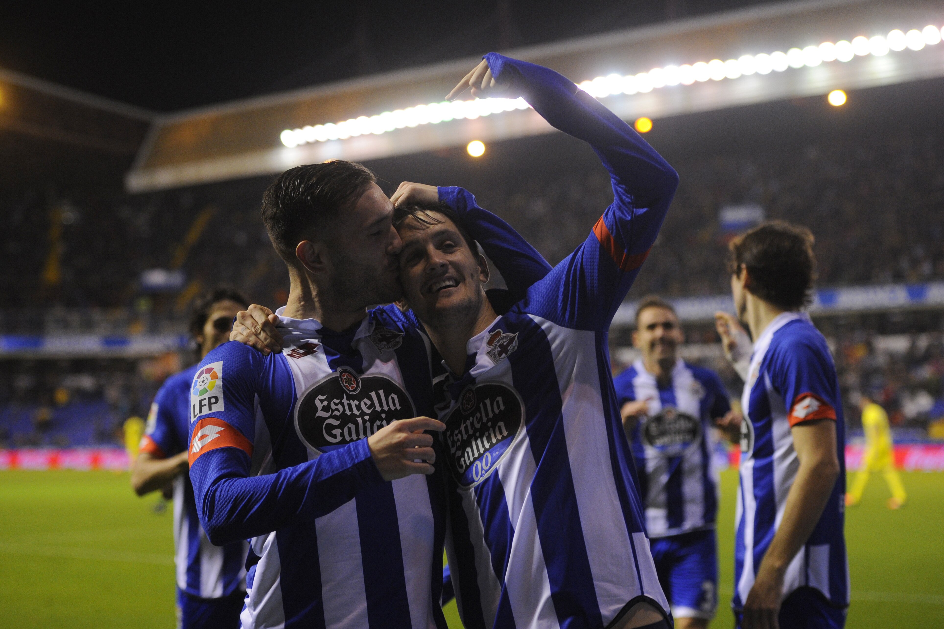 Deportivo La Coruna's midfielder Luis Alberto (R) celebrates with teammate midfielder Lucas Perez after scoring a goal during the Spanish league football match RC Deportivo de la Coruna vs Villarreal CF at the Municipal de Riazor stadium in La Coruna on January 3, 2016. AFP PHOTO/ MIGUEL RIOPA / AFP / MIGUEL RIOPA (Photo credit should read MIGUEL RIOPA/AFP/Getty Images)