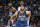 Minnesota Timberwolves center Karl-Anthony Towns (32), front, boxes out Denver Nuggets forward Kenneth Faried (35), center, as Minnesota Timberwolves guard Andrew Wiggins (22) looks on in the second half of an NBA basketball game Friday, Dec.11, 2015, in Denver. Denver won 111-108 in overtime. (AP Photo/David Zalubowski)