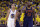 Golden State Warriors guard Stephen Curry (30) and Cleveland Cavaliers forward LeBron James (23) walk on the floor during the second half of Game 1 of basketball's NBA Finals in Oakland, Calif., Thursday, June 4, 2015. (AP Photo/Ben Margot)