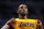 Los Angeles Lakers guard Kobe Bryant (24) holds out his jersey while on the court in the second half of an NBA basketball game against the Washington Wizards, Wednesday, Dec. 3, 2014, in Washington. The Wizards won 111-95. (AP Photo/Alex Brandon)