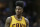 Cleveland Cavaliers' Iman Shumpert is shown during a timeout in the second half of an NBA basketball game against the New Orleans Pelicans, Saturday, Feb. 6, 2016, in Cleveland. (AP Photo/Tony Dejak)