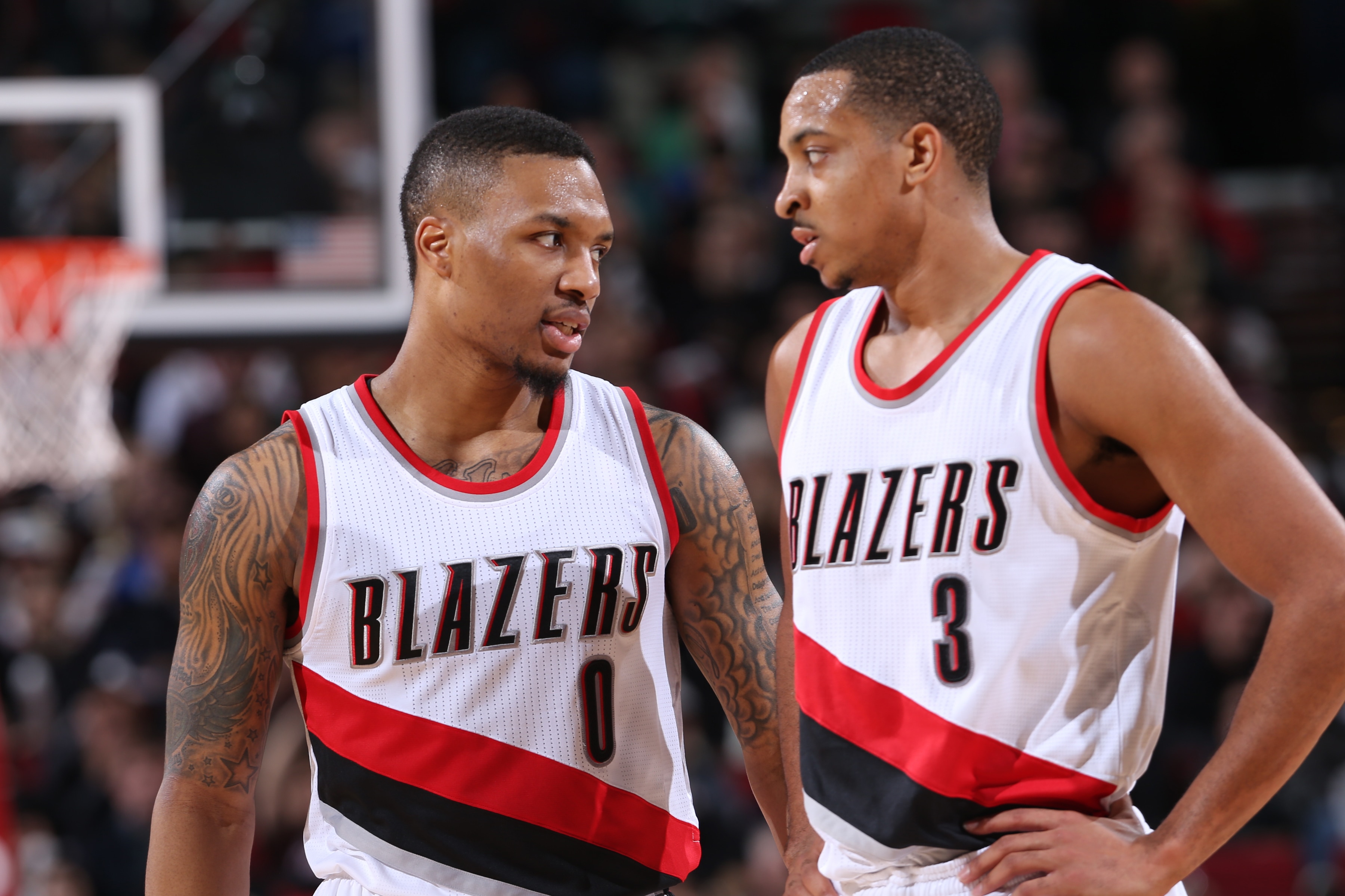 PORTLAND, OR - JANUARY 31: Damian Lillard #0 and C.J. McCollum #3 of the Portland Trail Blazers talks during the game against the Minnesota Timberwolves on January 31, 2016 at the Moda Center Arena in Portland, Oregon. NOTE TO USER: User expressly acknowledges and agrees that, by downloading and or using this photograph, user is consenting to the terms and conditions of the Getty Images License Agreement. Mandatory Copyright Notice: Copyright 2016 NBAE (Photo by Sam Forencich/NBAE via Getty Images)