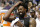 Los Angeles Clippers forward DeAndre Jordan (6) looks on from the bench as the Clippers take a 29 point lead during the second half of an NBA basketball game against the Dallas Mavericks Monday, March 7, 2016, in Dallas. (AP Photo/Brandon Wade)