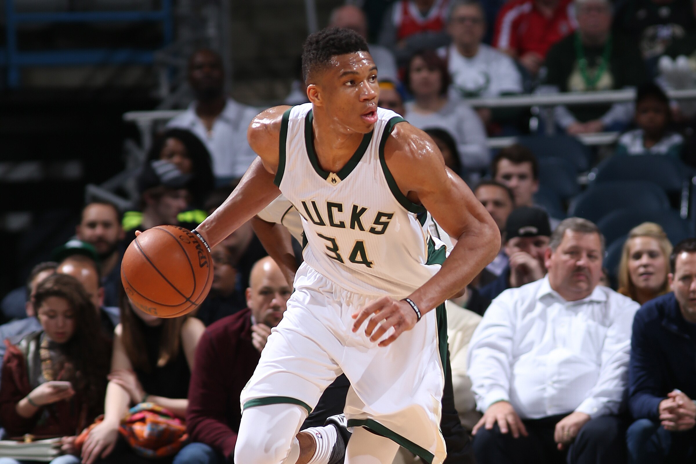 Milwaukee, WI - MARCH 15: Giannis Antetokounmpo #34 of the Milwaukee Bucks handles the ball against the Toronto Raptors on March 15, 2016 at the BMO Harris Bradley Center in Milwaukee, Wisconsin. NOTE TO USER: User expressly acknowledges and agrees that, by downloading and or using this Photograph, user is consenting to the terms and conditions of the Getty Images License Agreement. Mandatory Copyright Notice: Copyright 2016 NBAE (Photo by Gary Dineen/NBAE via Getty Images)