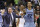 Memphis Grizzlies head coach David Joerger holds back Matt Barnes (22) after a double technical was called on Joerger and Milwaukee Bucks' John Henson during the second half of an NBA basketball game Thursday, March 17, 2016, in Milwaukee. The Bucks won 96-86. (AP Photo/Morry Gash)