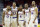 Kansas' Frank Mason III (0), Landen Lucas (33), Devonte' Graham (4), Wayne Selden Jr. (1) and Perry Ellis (34) gather during the second half of a second-round men's college basketball game against Connecticut in the NCAA Tournament, Saturday, March 19, 2016, in Des Moines, Iowa. Kansas won 73-61. (AP Photo/Charlie Neibergall)