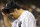 New York Yankees starting pitcher Nathan Eovaldi touches his cap as he enters the dugout in the fifth inning of a baseball game against the Houston Astros at Yankee Stadium in New York, Monday, Aug. 24, 2015.  (AP Photo/Kathy Willens)