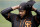 San Francisco Giants pitcher Johnny Cueto puts on a cap before practice for the spring baseball season in Scottsdale, Ariz., Thursday, Feb. 18, 2016. (AP Photo/Chris Carlson)