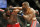 Daniel Cormier hits Jon Jones during their light heavyweight title mixed martial arts bout at UFC 182, Saturday, Jan. 3, 2015, in Las Vegas. (AP Photo/John Locher)