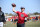 Some quarterbacks will compete in two Elite 11 regional competitions a year. Blackshear, Georgia, quarterback Stetson Bennett IV has competed in five. Wearing a U.S. Postal Service hat, he's earned the nicknames "Mailman" and "Postman" on the camp circuit.