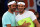 Spain's Rafael Nadal of the Indian Aces (R) and Switzerland's Roger Federer of the Japan Warriors greet each other during practice at the International Premier Tennis League (IPTL) event in New Delhi on December 12, 2015. AFP PHOTO / SAJJAD HUSSAIN / AFP / SAJJAD HUSSAIN        (Photo credit should read SAJJAD HUSSAIN/AFP/Getty Images)