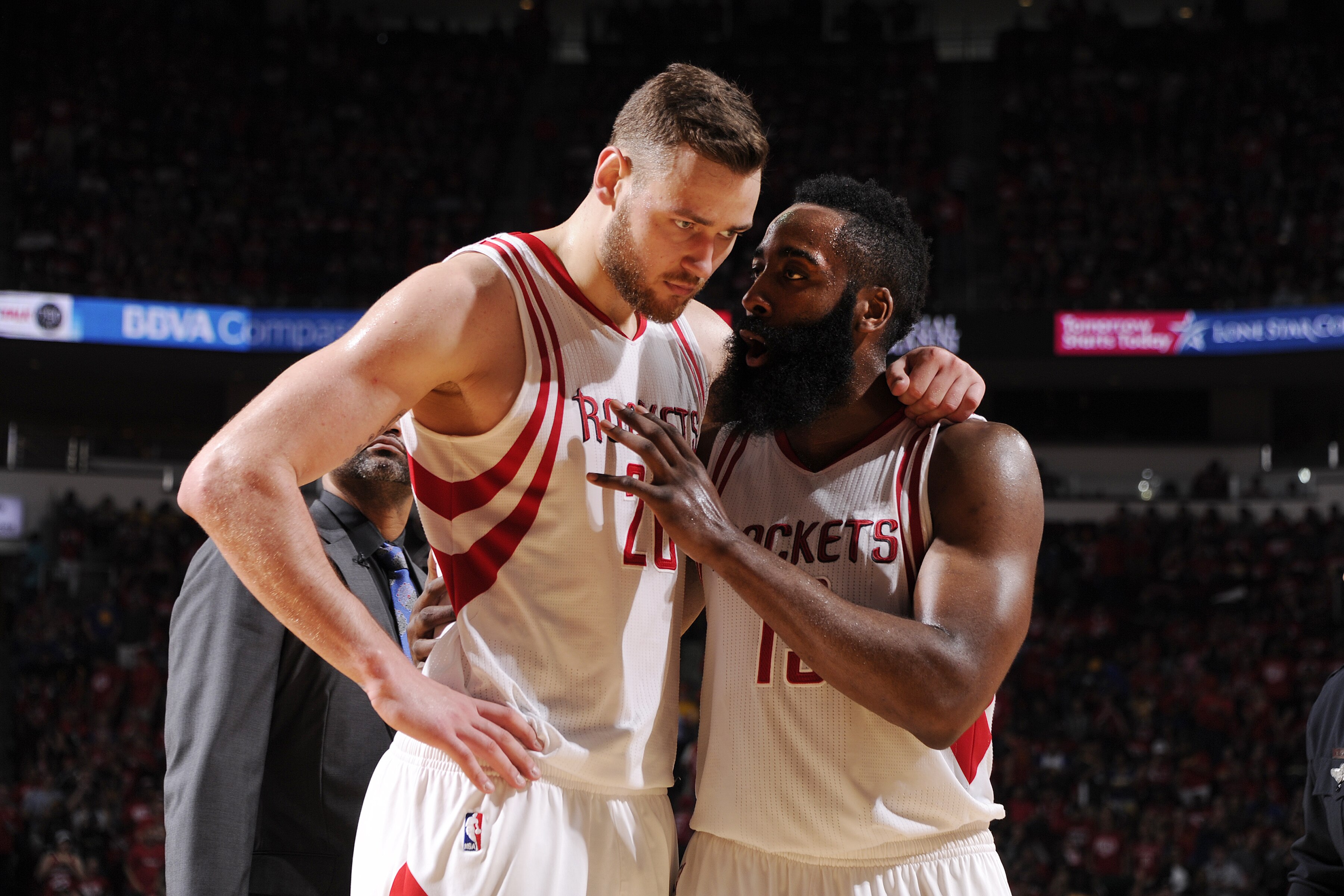 HOUSTON, TX - APRIL 24: James Harden #13 of the Houston Rockets and Donatas Motiejunas #20 of the Houston Rockets talk during the game against the Golden State Warriors in Game Four of the Western Conference Quarterfinals during the 2016 NBA Playoffs on April 24, 2016 at the Toyota Center in Houston, Texas. NOTE TO USER: User expressly acknowledges and agrees that, by downloading and or using this photograph, User is consenting to the terms and conditions of the Getty Images License Agreement. Mandatory Copyright Notice: Copyright 2016 NBAE (Photo by Bill Baptist/NBAE via Getty Images)