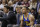 Golden State Warriors coach Steve Kerr, center, talks with guard Stephen Curry on the bench during the first half against the Cleveland Cavaliers in Game 3 of basketball's NBA Finals in Cleveland, Wednesday, June 8, 2016. Cleveland won 120-90. (AP Photo/Tony Dejak)