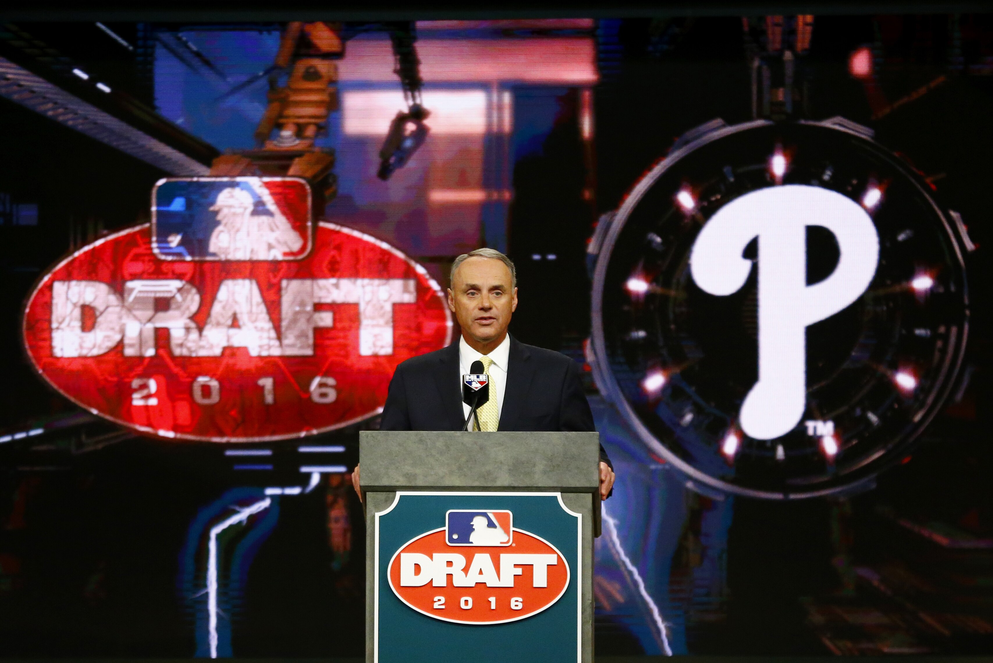 Baseball Commissioner Rob Manfred announces the No. 1 pick by the Philadelphia Phillies during the draft, Thursday, June 9, 2016, in Secaucus, N.J. The Phillies selected outfielder Mickey Moniak, of La Costa Canyon High School in Carlsbad, Calif., with the first pick. (AP Photo/Julio Cortez)