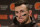 FILE - In this Dec. 20, 2015, file photo, Cleveland Browns quarterback Johnny Manziel speaks with media members following the team's 30-13 loss to the Seattle Seahawks in an NFL football game, in Seattle. Manziel has been suspended for the first four games of next season for violating the NFL's substance-abuse policy.The suspension announced Thursday, June 30, 2016, is not related to the NFL's domestic violence policy, but the free agent quarterback would be subject to it if he signs with another team. (AP Photo/Scott Eklund, File)