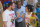 Matt Stonie, right, reigning hot dog-eating champion, stares down eight-time champion Joey Chestnut during the official weigh in for Nathans Famous hot dog eating contest, Friday, July 1, 2016, in New York. Brooklyn borough President Eric Adams stand between the men. (AP Photo/Mary Altaffer)